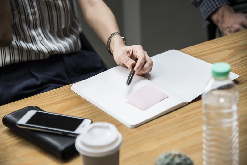 employment, manager, busy, career, holding, writing, table, ideas, men, human hand, paper, lifestyle, glass, wood - material, brainstorming, pen, corporate