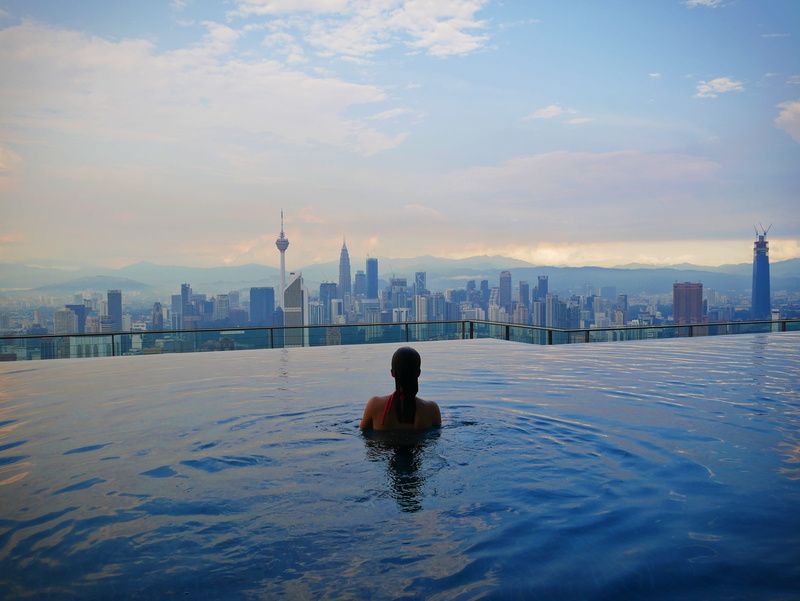 tropical, real people, pool with a view, lifestyles, city, 4K, outdoors, one person, kuala lumpur city, looking at view, sky, built structure, roof, landscape