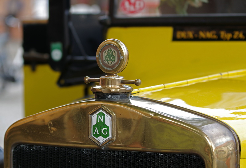 public transportation, communication, motor vehicle, auto, travel, brass radiator, no people, outdoors, car, text, transportation, nag, oldtimer, city