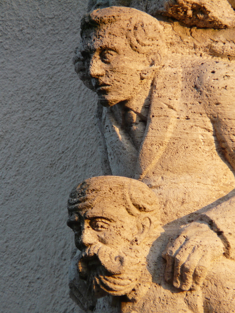 2K, representation, human representation, close-up, craft, sculpture, no people, portrait, figures, head, built structure, one above the other, faces