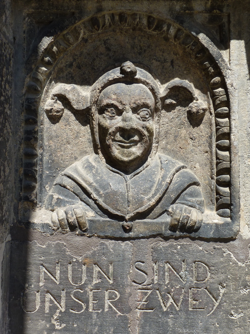 carving - craft product, built structure, low angle view, the past, statue, nördlingen, craft, ornate, human representation, no people, history, text, fool