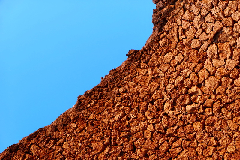 brick, archaeology, day, rock formation, outdoors, stone, clear sky, rock, brown, antique, sky, solid, no people, orange, land, blue, campania, low angle view
