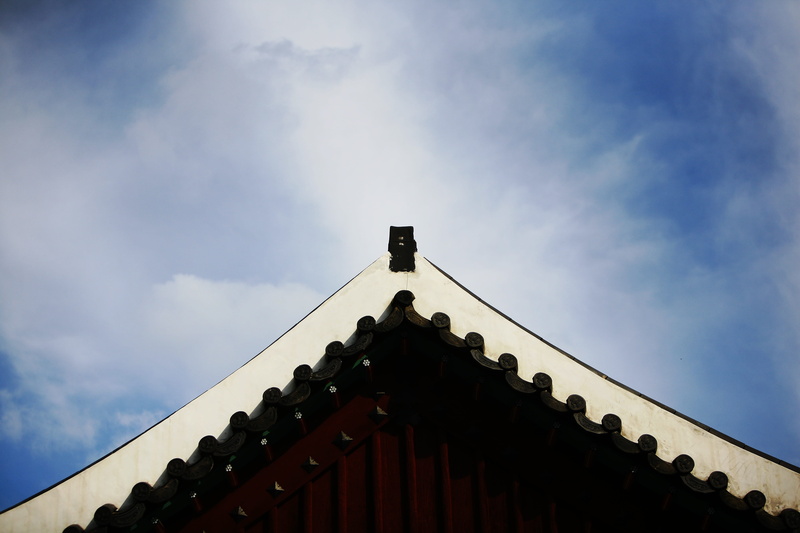 sunlight, architecture, no people, roof, building exterior, high section, roof tile, religion, built structure, low angle view, cloud - sky, sky, nature