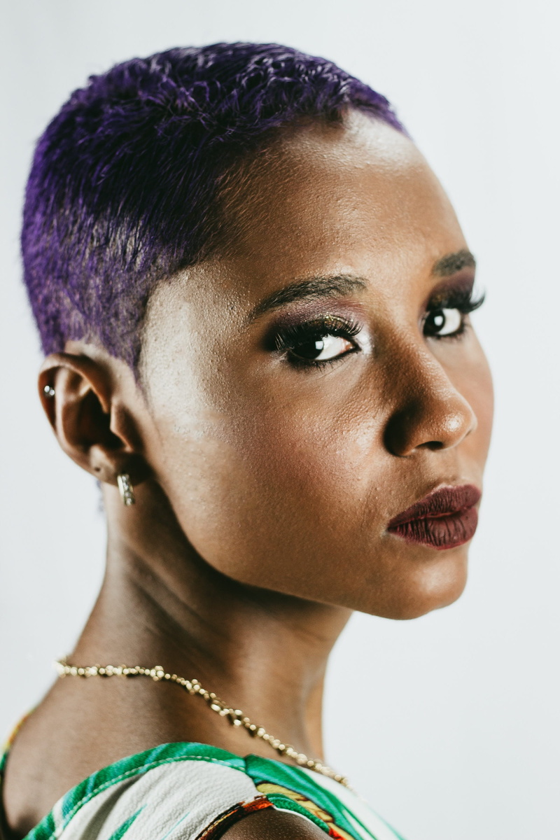 studio shot, adult, women, headshot, black skin, pose, taking, white, gold, close up, female, person, indoors, earring, model, looking away, portrait, young adult