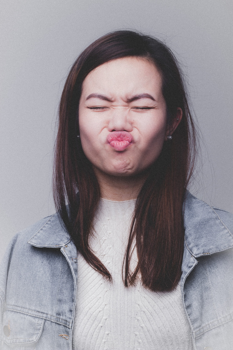wall, teenager, hairstyle, headshot, woman, top, play, face, fashion, women, person, lifestyles, wearing, young adult, beauty, beautiful woman, jacket