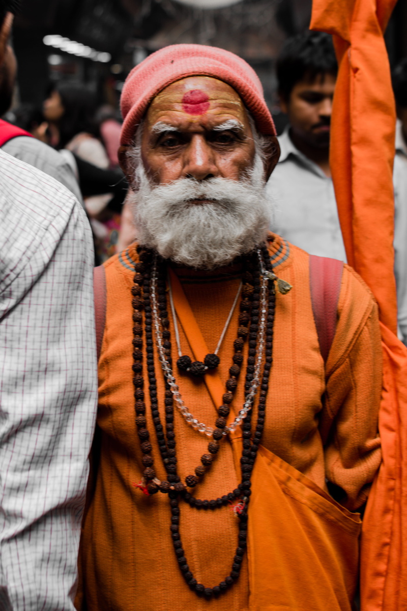 suit, front view, jacket, red, elderly man, focus on foreground, belief, facial expression, religion, wear, orange, warm clothing, social issues, lifestyles