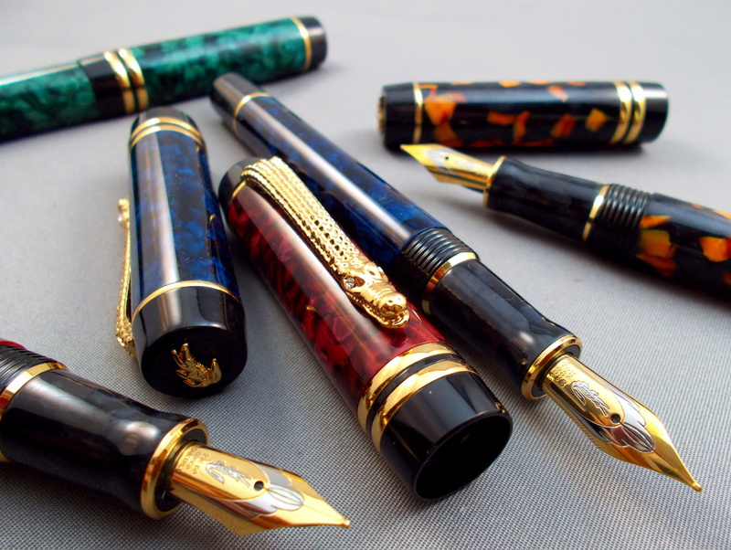 nibs, gun, crocodile, sign, indoors, communication, still life, writing, his nibs, pen, aggression, industry, ink pen, ammunition, table, fountain Pen