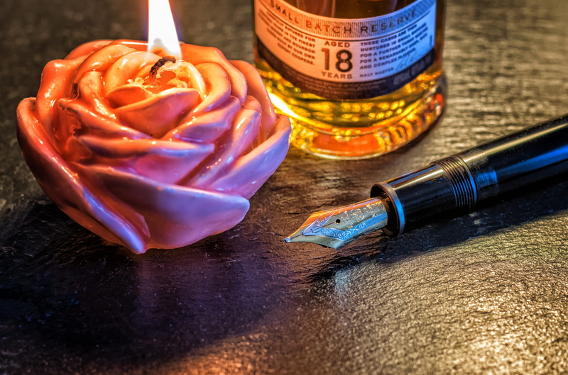 leave, indoors, bottle, still life, currency, freshness, 4K, no people, pen, close-up, wood - material, light, high angle view, focus on foreground, mont blanc