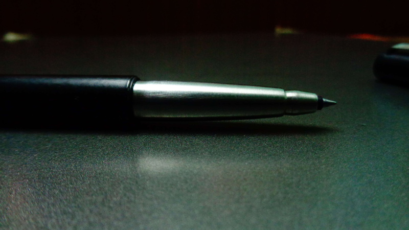 silver colored, high angle view, metal, close-up, two objects, table, pen, indoors, writing instrument, fountain pen, 4K, aggression, business, nib, single object
