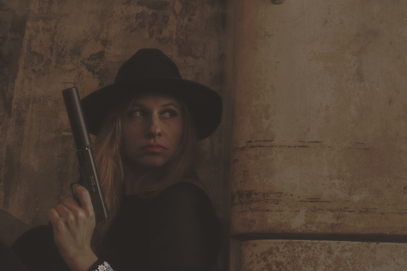 lifestyles, cinema, front view, crime, young adult, mafia, murder, real people, the movie, wall - building feature, looking away, aggression, hat, contemplation