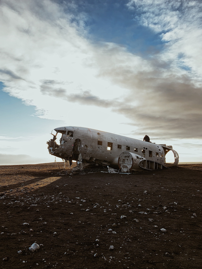 person, climate, obsolete, field, vehicle, accidents and disasters, shoot, view, iceland, plane, land, outdoors, landing, aircraft, day, nature, human