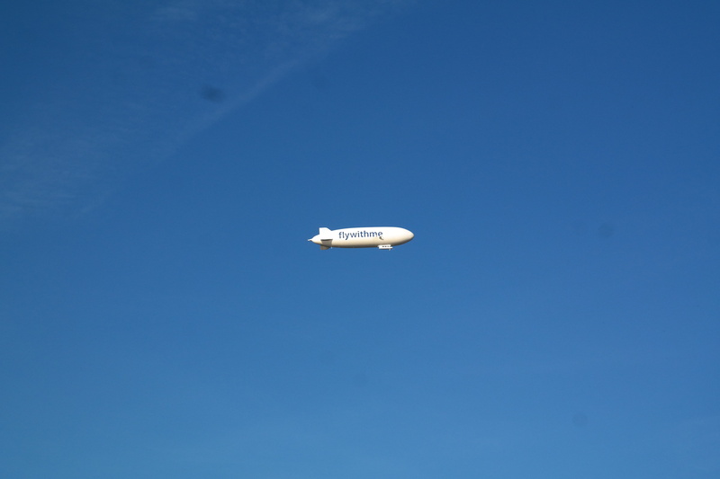 air vehicle, sunny, copy space, low angle view, nature, aerospace industry, mid-air, Blue, Zeppelin, sky, white, no people, outdoors, travel, motion, flying