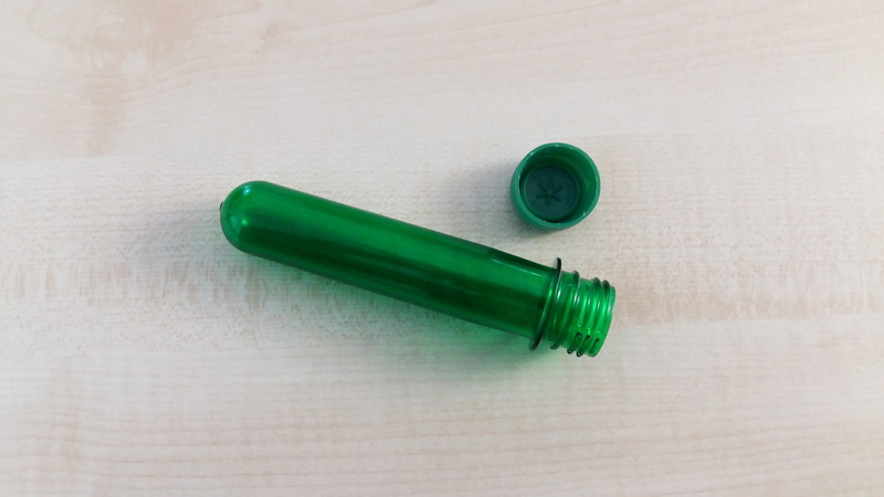 bottle, medicine, focus on foreground, plastic, medical supplies, studio shot, geocache, 4K, form, indoors, petling, two objects, table, green color, no people