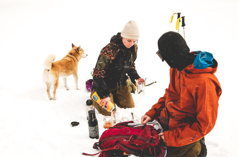 mammal, white background, food, bottle, drink, pets, mountains, lake tahoe, togetherness, adult, beverage, persons, human, canine, ground, snowy, united states