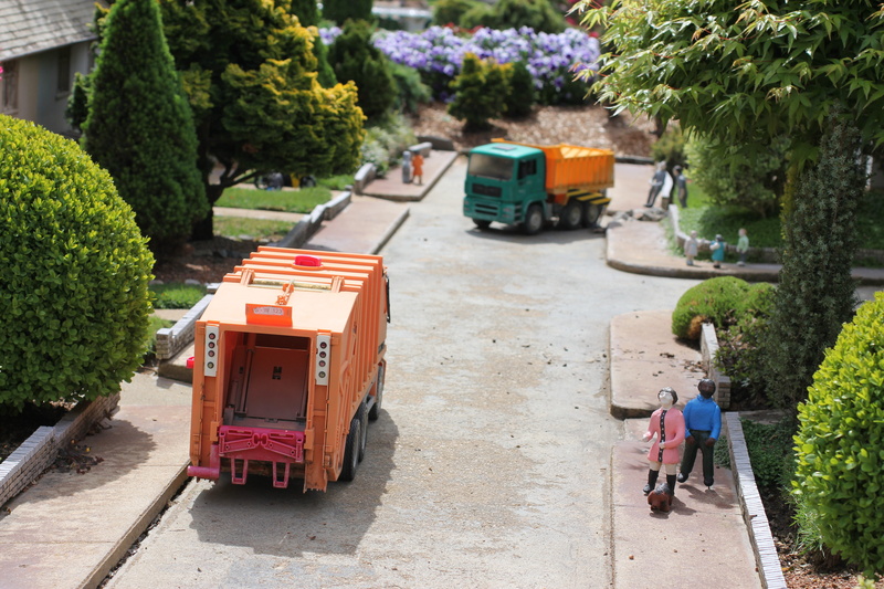 waste, footpath, nature, mode of transportation, mini, green color, tree, sanitation, small, community, day, trash, garbage, dump truck, lorry, group of people