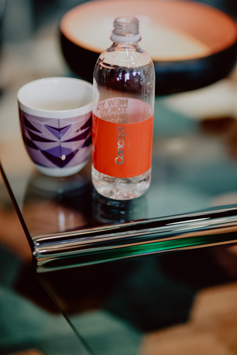 household equipment, water, bottles, indoors, art and craft, close-up, freshness, drink, aqua, focus on foreground, cup, refreshment, soda, kitchen utensil