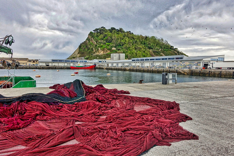 built structure, fishing, land, mesh, fisherman, bay, fishing nets, water, netting, fishnet, outdoors, sky, cloud - sky, fisher, nautical, red, nets, no people