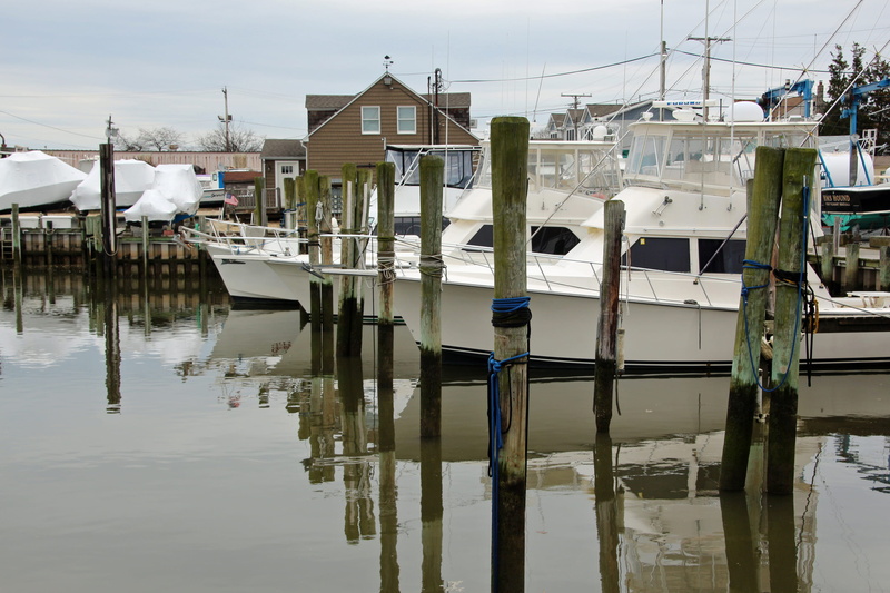 built structure, point, water, moored, wooden post, reflection, fishing charters, mode of transportation, dock, fishing boat, waterfront, jersey, charter boat fishing