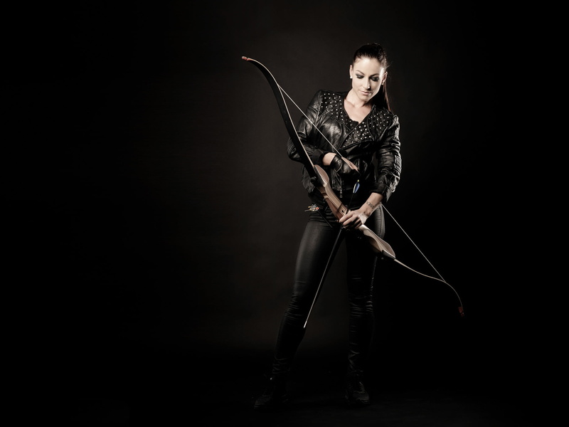 looking at camera, 1080P, warrior - person, brown, full length, aggression, young adult, girl, anger, dark, studio shot, front view, recurve, holding