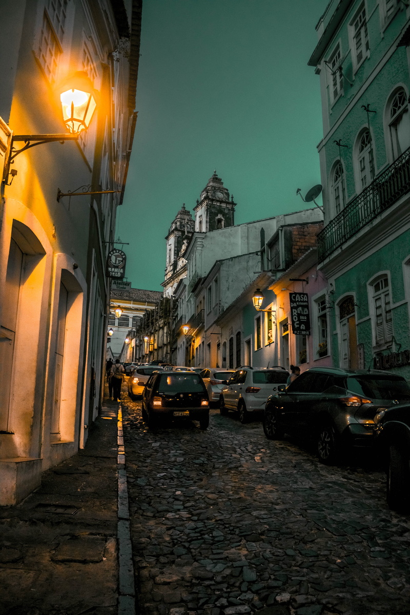 nautical vessel, walls, building exterior, urban, parked, building, canal, street, lamps, no people, parked cars, narrow, town, 5K, street lamps, cobblestone street