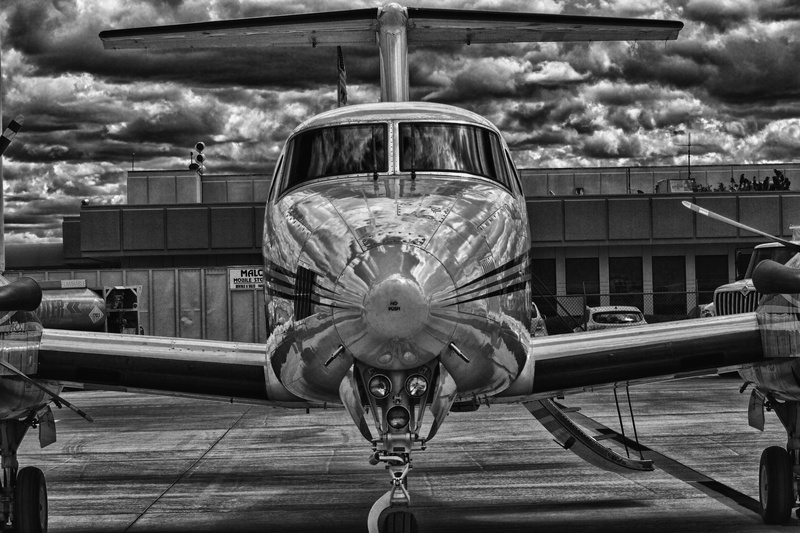 drama, building exterior, dramatic, water, day, detail, airplane, outdoors, fancy plane, mode of transportation, gloss, close-up, private jet, air, background