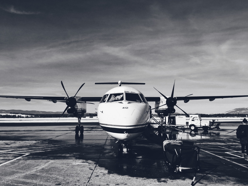 airplane, kalispell, 4K, airport runway, sunlight, water, luxury, propeller, black and white, day, public transportation, sky, bi-plane, aerospace industry