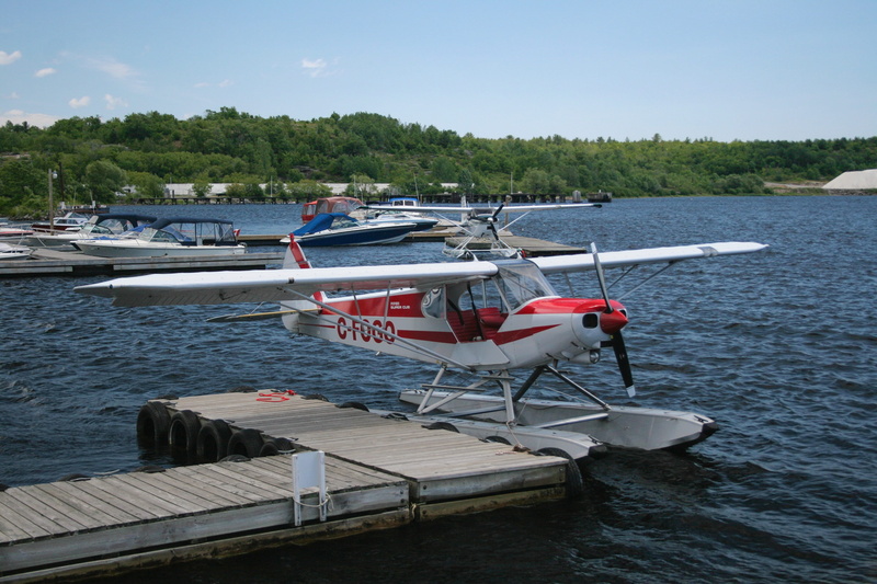 nature, tranquil scene, tranquility, sea, airplane, water, passenger craft, pier, transportation, aeroplane, moored, lake, no people, nautical vessel, vintage