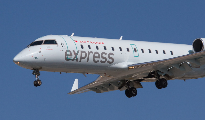 express, toronto pearson international airport, day, military, air georgian, side view, no people, canada, jet, aircraft, sky, flight, plane, mode of transportation