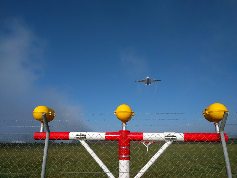 Airport, outdoors, fence, lighting equipment, oberglatt, landing, clear sky, airport zurich, Zurich, barbed wire, boundary, sky, security, flying, blue