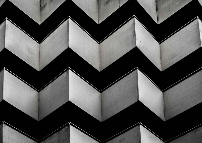 symmetry, full frame, wall - building feature, chevron, shape, black, window, geometric shape, pattern, grey, architecture, close-up, built structure