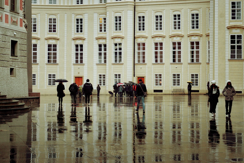 building exterior, umbrellas, window, tourists, water, group of people, st. vitus cathedral, real people, building, built structure, city, rainy season