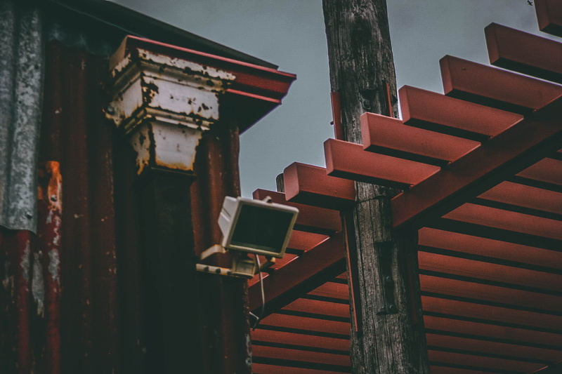 railing, rusty, group of objects, rustic, wooden, day, built structure, outdoors, beams, metal, pattern, light, building, grey, building exterior, staircase