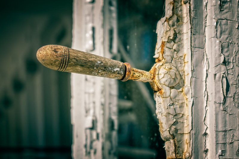 color, weathered, no people, old, wooden windows, rusty, bolt, entrance, built structure, closure, wooden handle, lever, outdoors, handle, sunlight, focus on foreground