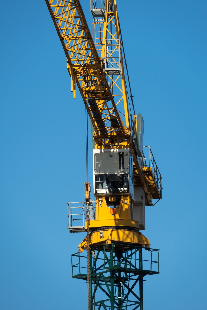architecture, outdoors, construction equipment, load crane, work, construction site, crane cab, clear sky, construction machinery, industrial equipment