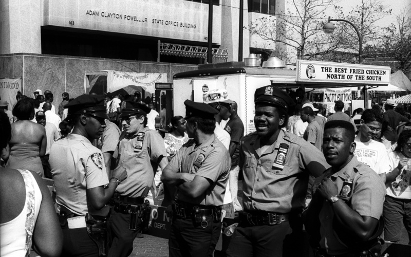 women, communication, police, group of people, architecture, city, adult, street, harlem, united states, real people, building exterior, lifestyles, crowd