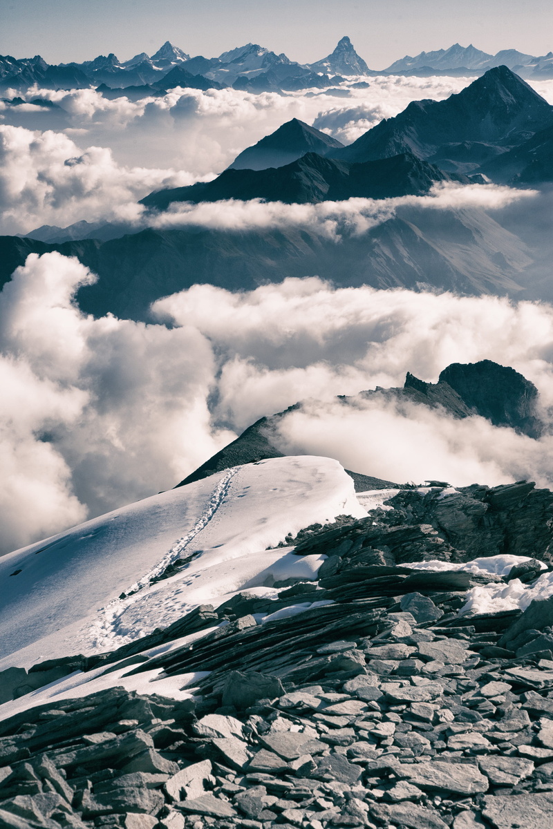 cloud, snow, mountain peak, track, beauty in nature, top, glacier, cloud - sky, tranquility, peak, ice, clouds, outdoors, idyllic, aerial view, water, photo