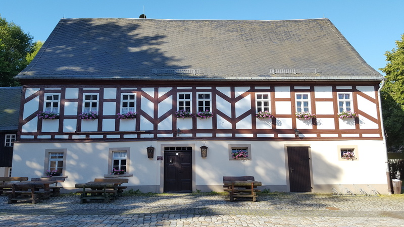 building, outdoors, sunlight, day, clear sky, residential district, sky, bone pestle the village of chemnitz, architecture, plant, house, built structure
