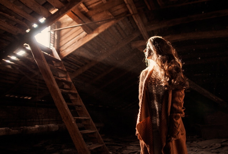 attics, sunlight, hairstyle, three quarter length, adult, brown hair, casual clothing, low angle view, indoors, women, one person, ladders, abandoned, long hair