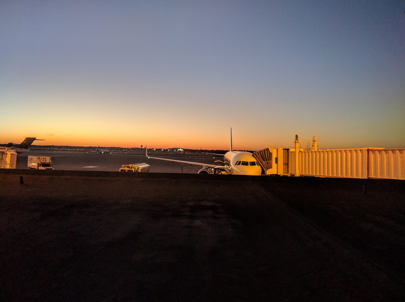 cleveland, sunset, built structure, air vehicle, building exterior, mode of transportation, clear sky, illuminated, sky, no people, transportation, united states