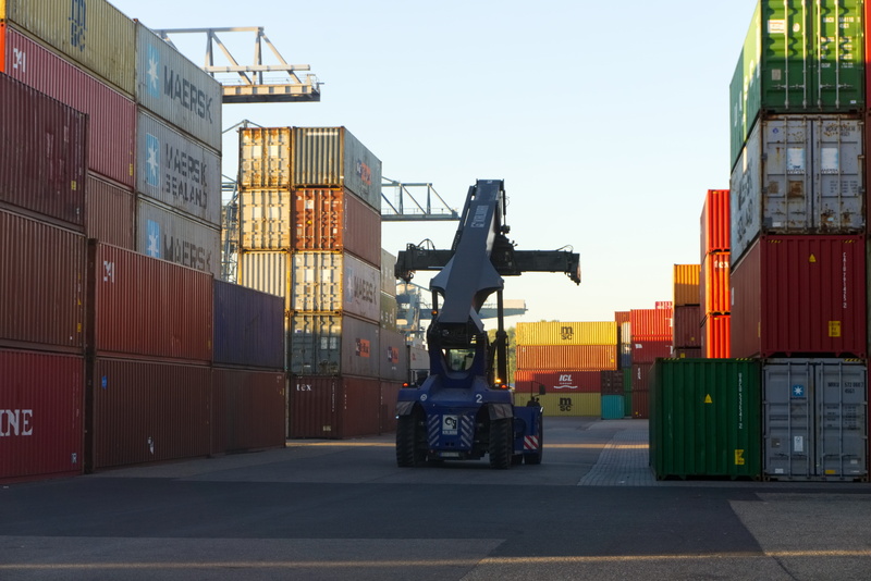 machinery, outdoors, cargo container, stack, day, transportation, mode of transportation, built structure, sunrise, port, business, loading, container
