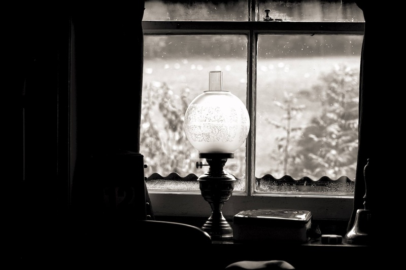 indoors, focus on foreground, dark, day, close-up, electric lamp, still life, glass - material, table, kerosene, photography, bottle, glass, window, hanging