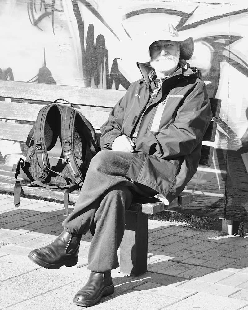 sunlight, artist, casual clothing, music, stories, it’s port adelaide, glasses, community, young adult, black and white, men, 2K, leisure activity, footpath