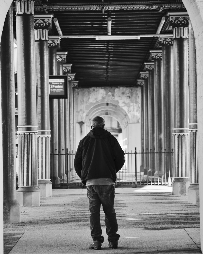 casual clothing, one person, rear view, arcade, lifestyles, port railway station, railway station, architectural column, building, its port adelaide, men