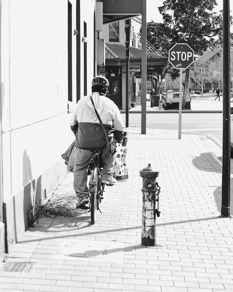 riding, sunlight, port adelaide, it’s port adelaide, day, community, black and white, real people, street photography, architecture, lifestyles, people