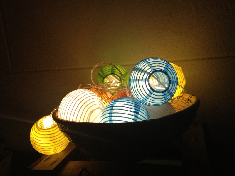 multi colored, lamps, lights, indoors, pattern, no people, table, lichterkette, illuminated, relaxation, light, wall - building feature, food and drink
