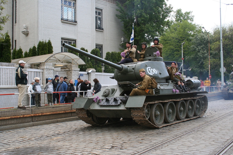sitting, travel, building exterior, 2K, lifestyles, conflict, military, gun, military parade, soldiers, army, armored Tank, weapon, large group of people
