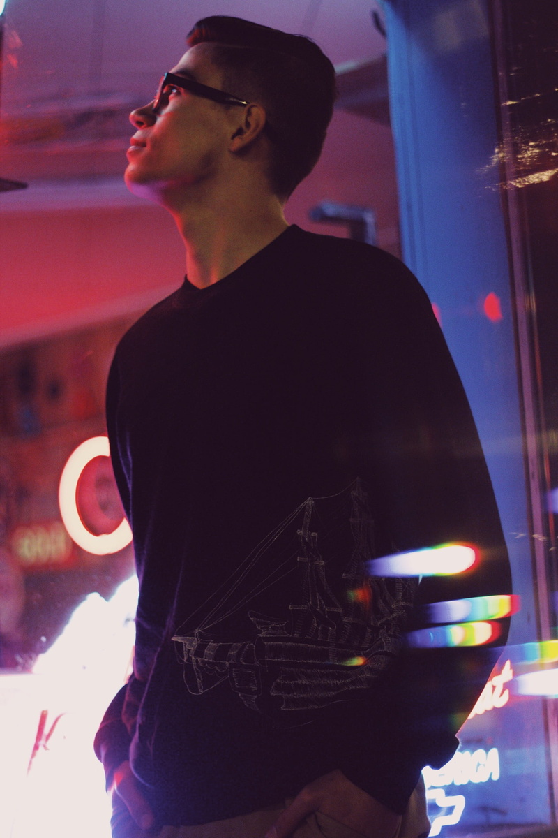 casual clothing, glasses, contemplation, looking away, illuminated, one person, looking, saskatoon, nightlife, standing, leisure activity, men, night, adult