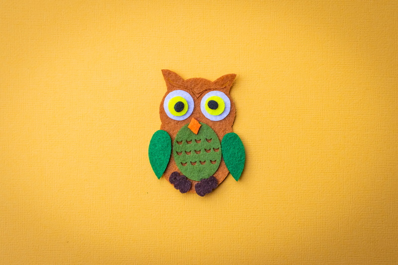 wall - building feature, patch, animal representation, design, animal, toy, yellow, domestic animals, green, copy space, brown, representation, craft, indoors