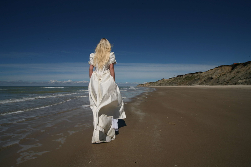 blond hair, scenic, women, cliff, land, sand, beach, full length, bride, hair, beauty in nature, sky, real people, nature, outdoors, horizon over water
