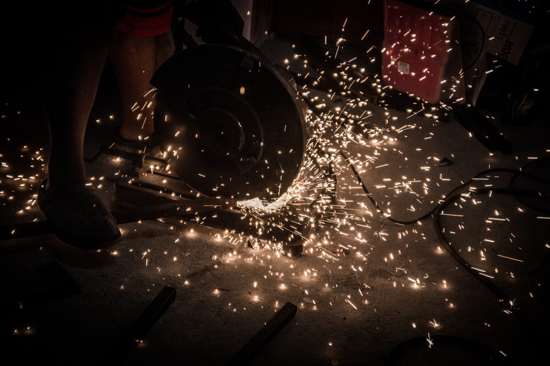 men, front view, mechanic, nature, garage, blurred motion, the light, sparks, human leg, low section, human limb, spatter, fire, night, one person, steel